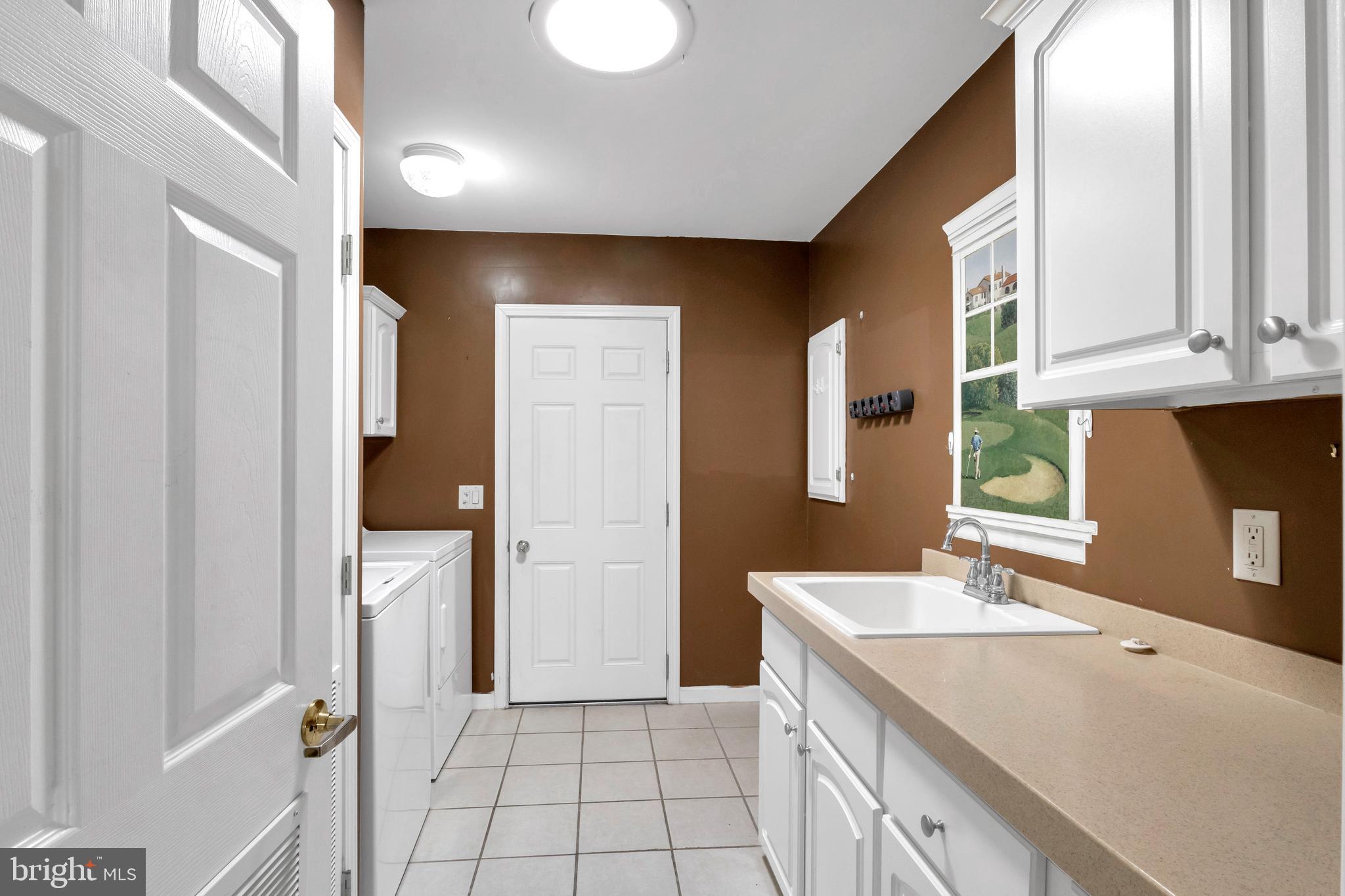 32530 Approach Way, Unit 3252 Millsboro, DE 19966 - Photo 33 of 54 a spacious bathroom with a granite countertop sink and a mirror