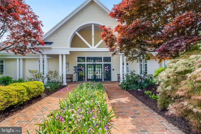 a view of a livingroom with couch and a large window