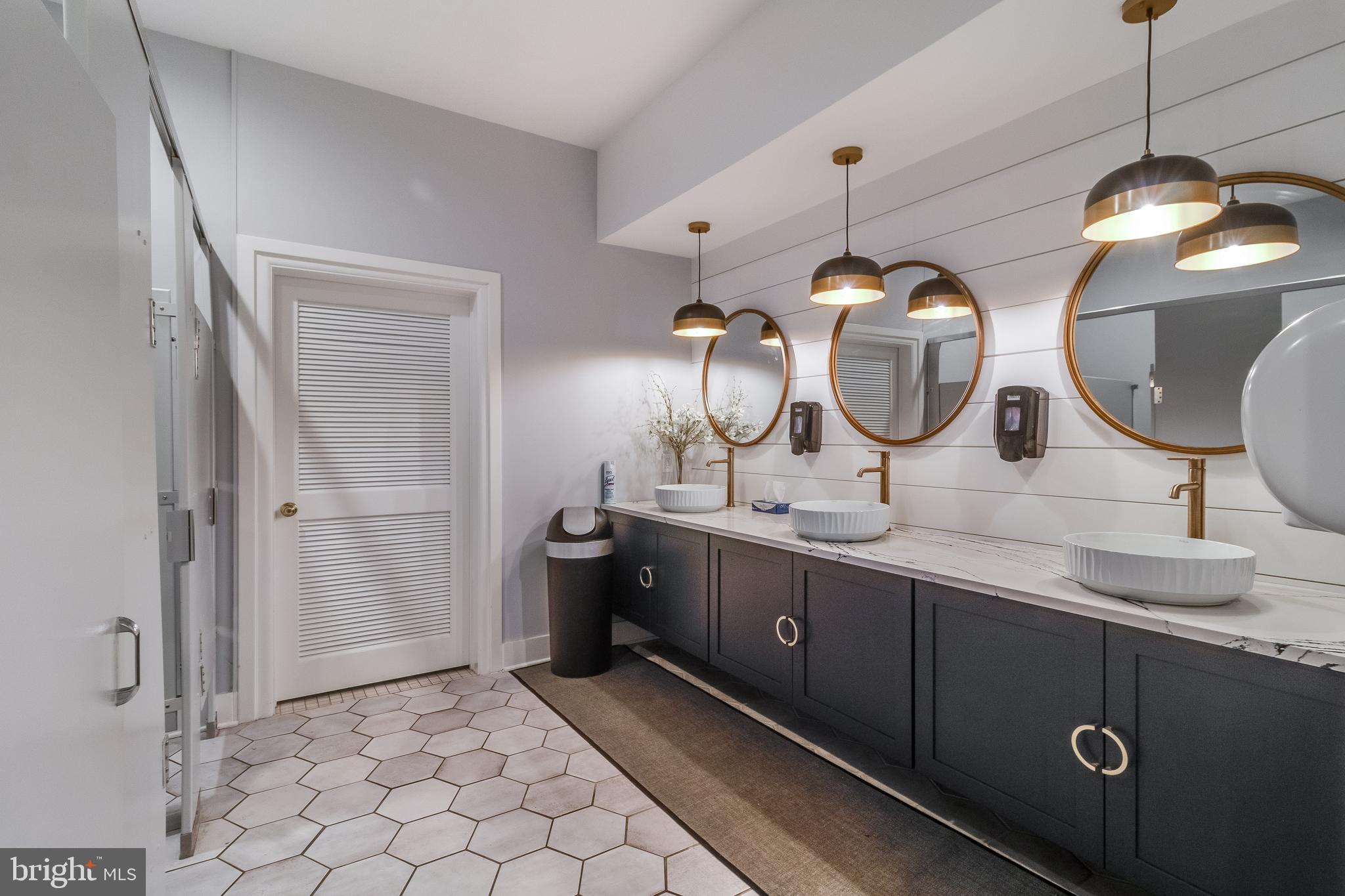 32530 Approach Way, Unit 3252 Millsboro, DE 19966 - Photo 44 of 54 a spacious bathroom with a double vanity sink mirror and shower