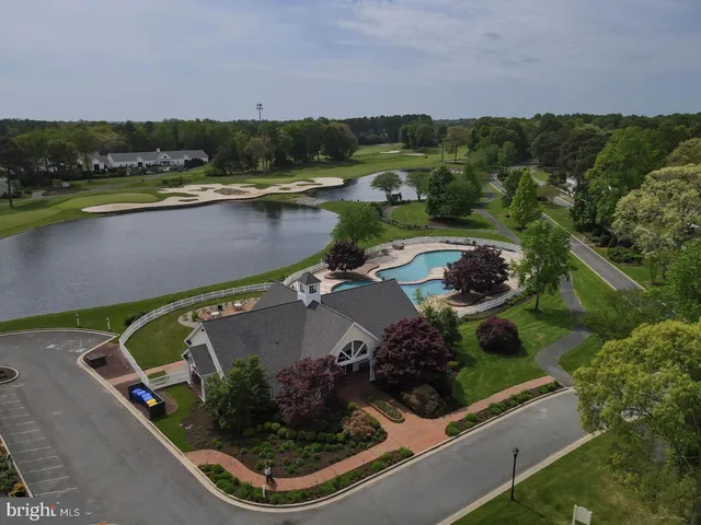 an aerial view of a house with a lake view