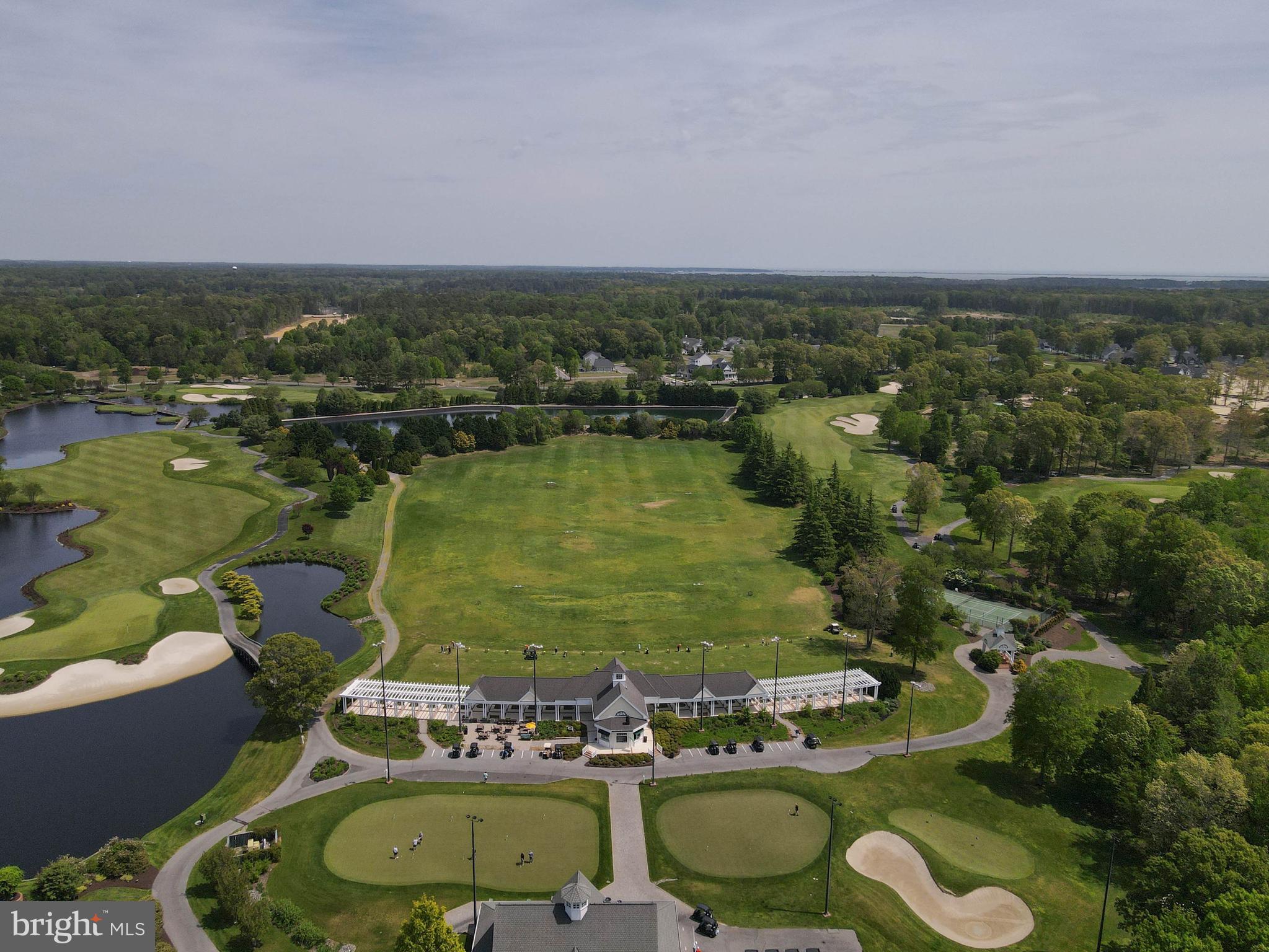 32530 Approach Way, Unit 3252 Millsboro, DE 19966 - Photo 49 of 54 an aerial view of a houses with outdoor space