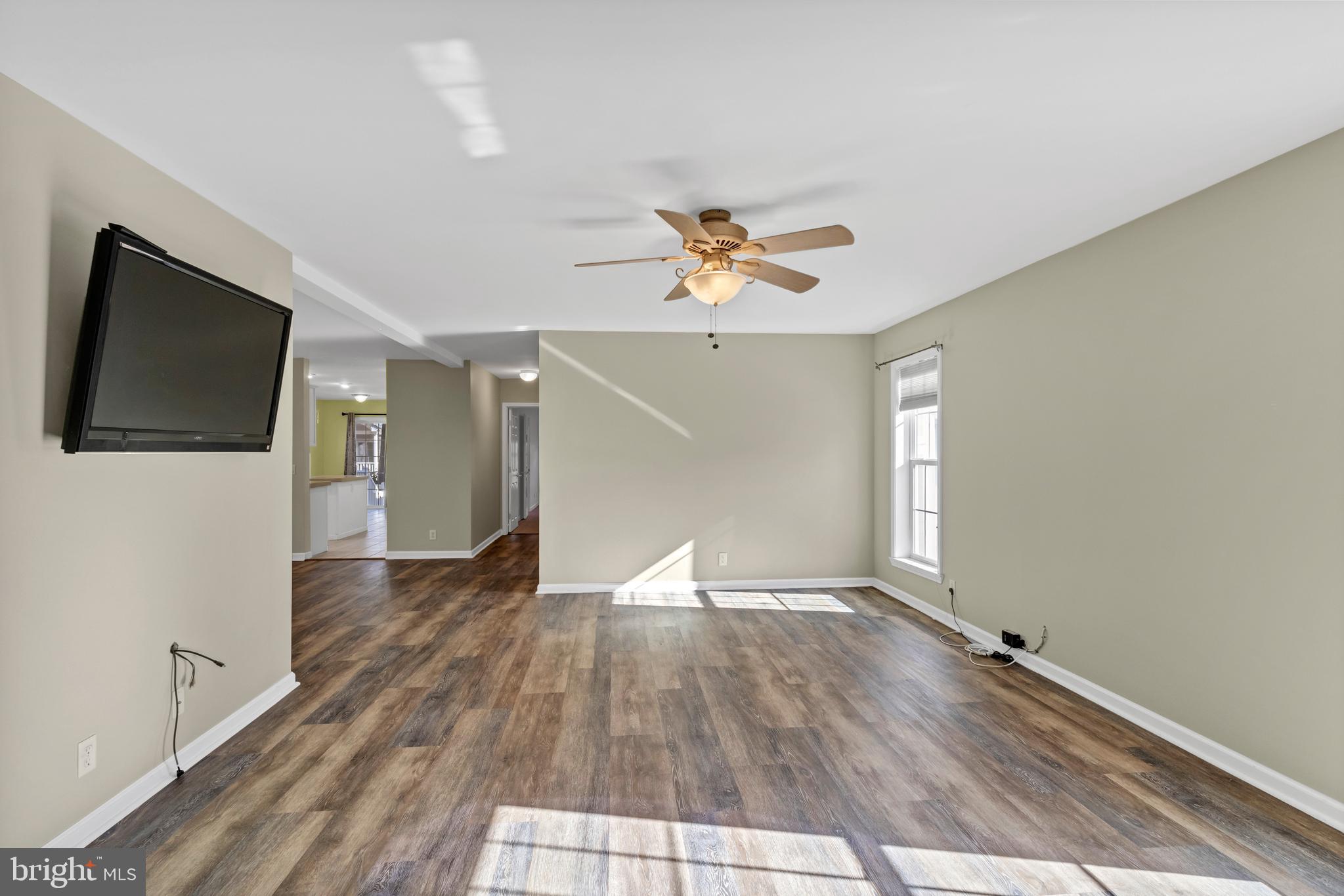 32530 Approach Way, Unit 3252 Millsboro, DE 19966 - Photo 8 of 54 a view of empty room with wooden floor and fan