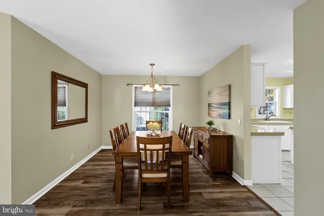 a view of a dining room with furniture and window