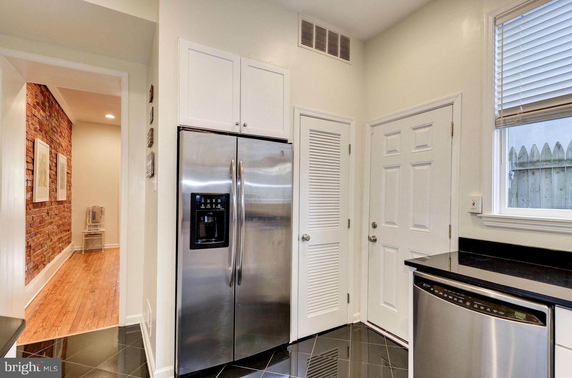 17 15th Street Southeast Washington, DC 20003 - Photo 11 of 28 a view of a kitchen with a refrigerator and wooden floor