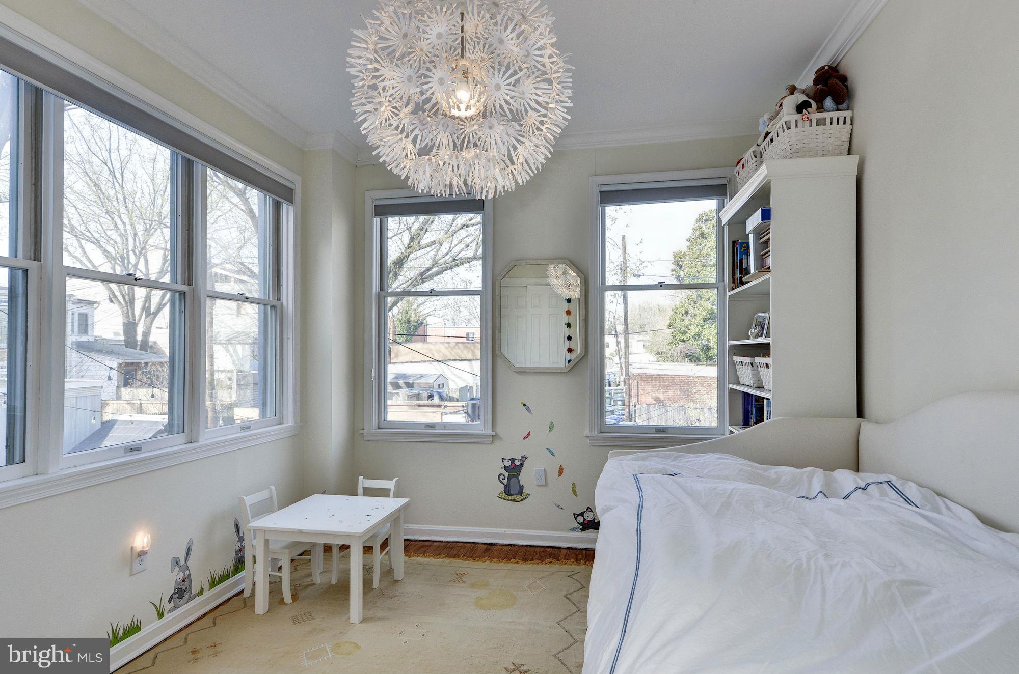 17 15th Street Southeast Washington, DC 20003 - Photo 20 of 28 a bedroom with a bed and a large window
