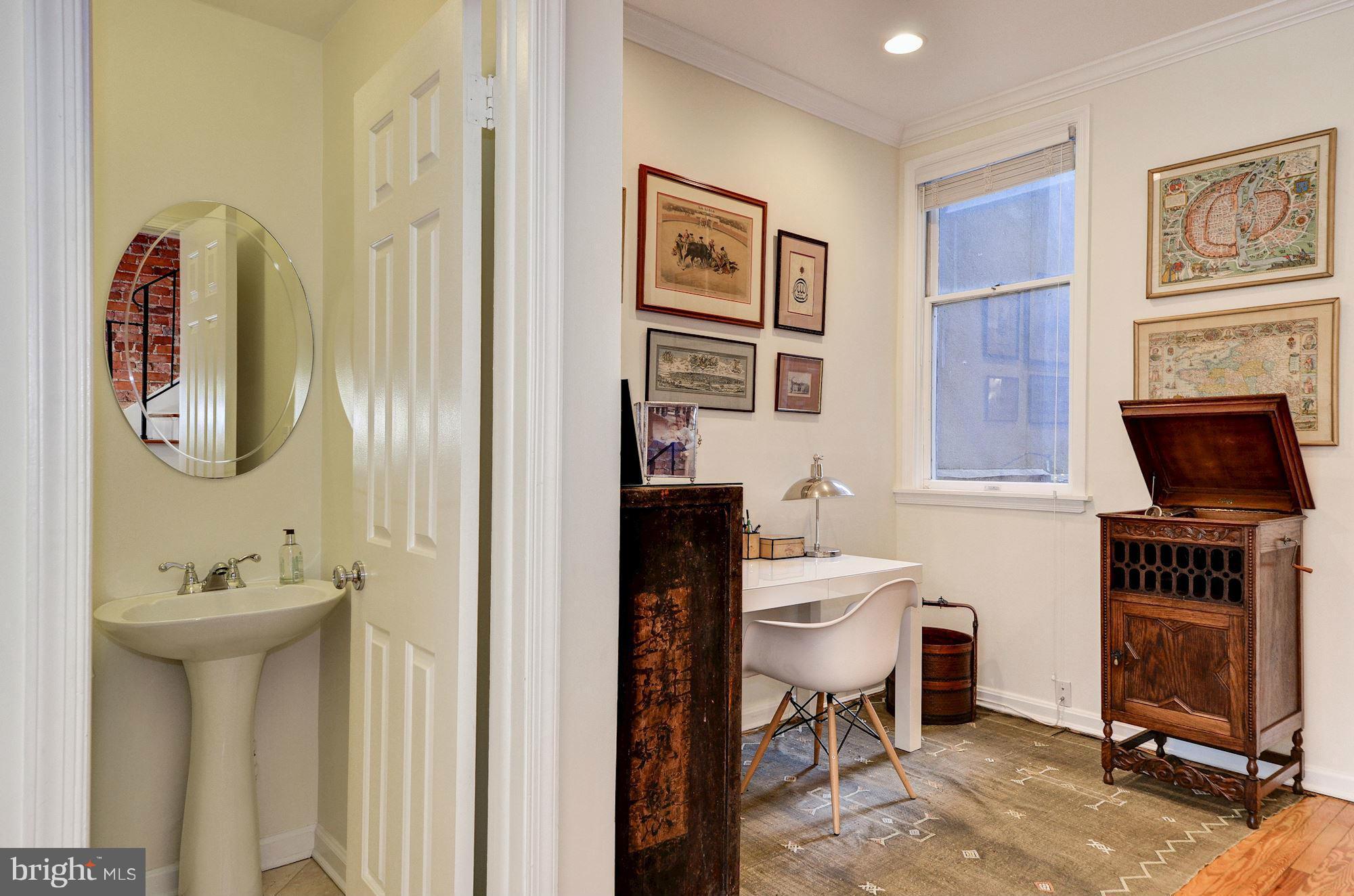 17 15th Street Southeast Washington, DC 20003 - Photo 8 of 28 a bathroom with a toilet a sink and mirror