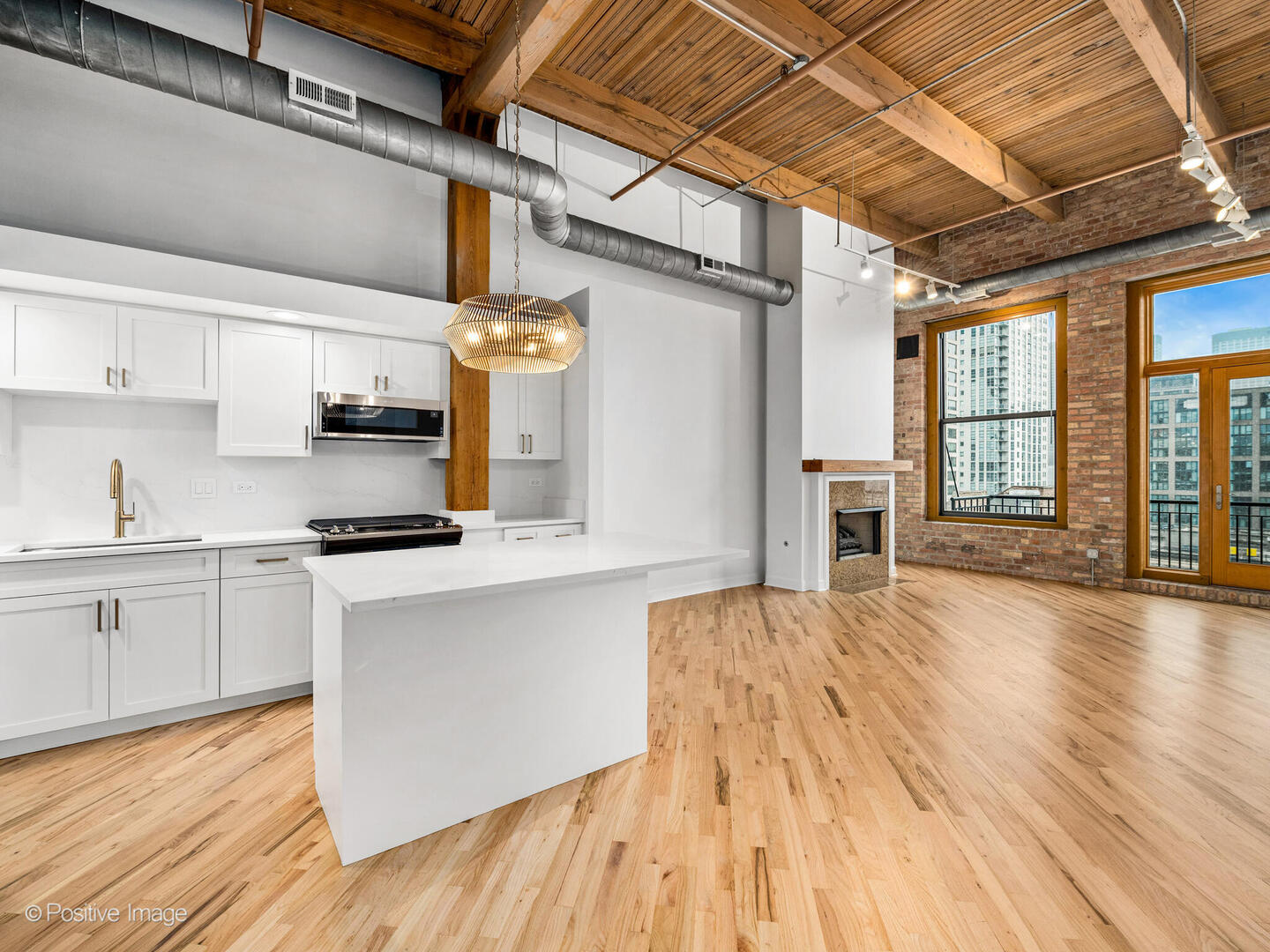 616 West Fulton Street, Unit 614 Chicago, IL 60661 - Photo 13 of 27 a kitchen with stainless steel appliances granite countertop a sink and cabinets