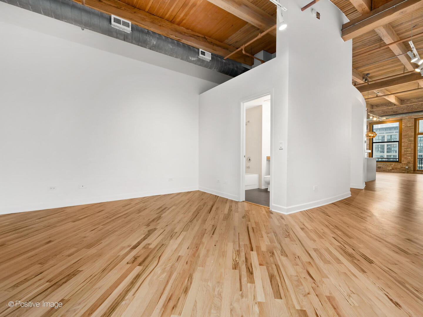 616 West Fulton Street, Unit 614 Chicago, IL 60661 - Photo 19 of 27 a view of a room with wooden floor