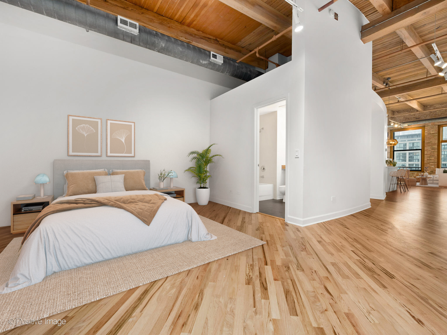 616 West Fulton Street, Unit 614 Chicago, IL 60661 - Photo 9 of 27 a spacious bedroom with a bed and wooden floor