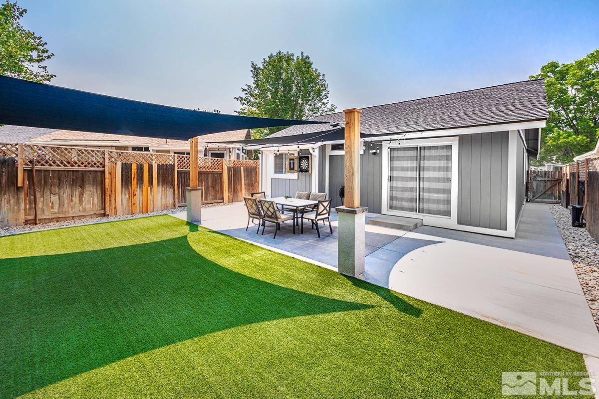 7686 Barnsdale Road Reno, NV 89511 - Photo 16 of 27 a view of a house with swimming pool and porch