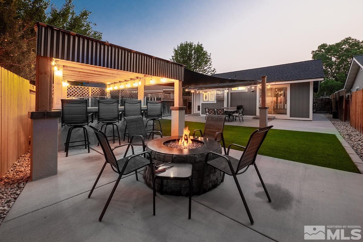 7686 Barnsdale Road Reno, NV 89511 - Photo 25 of 27 a view of a backyard with sitting area