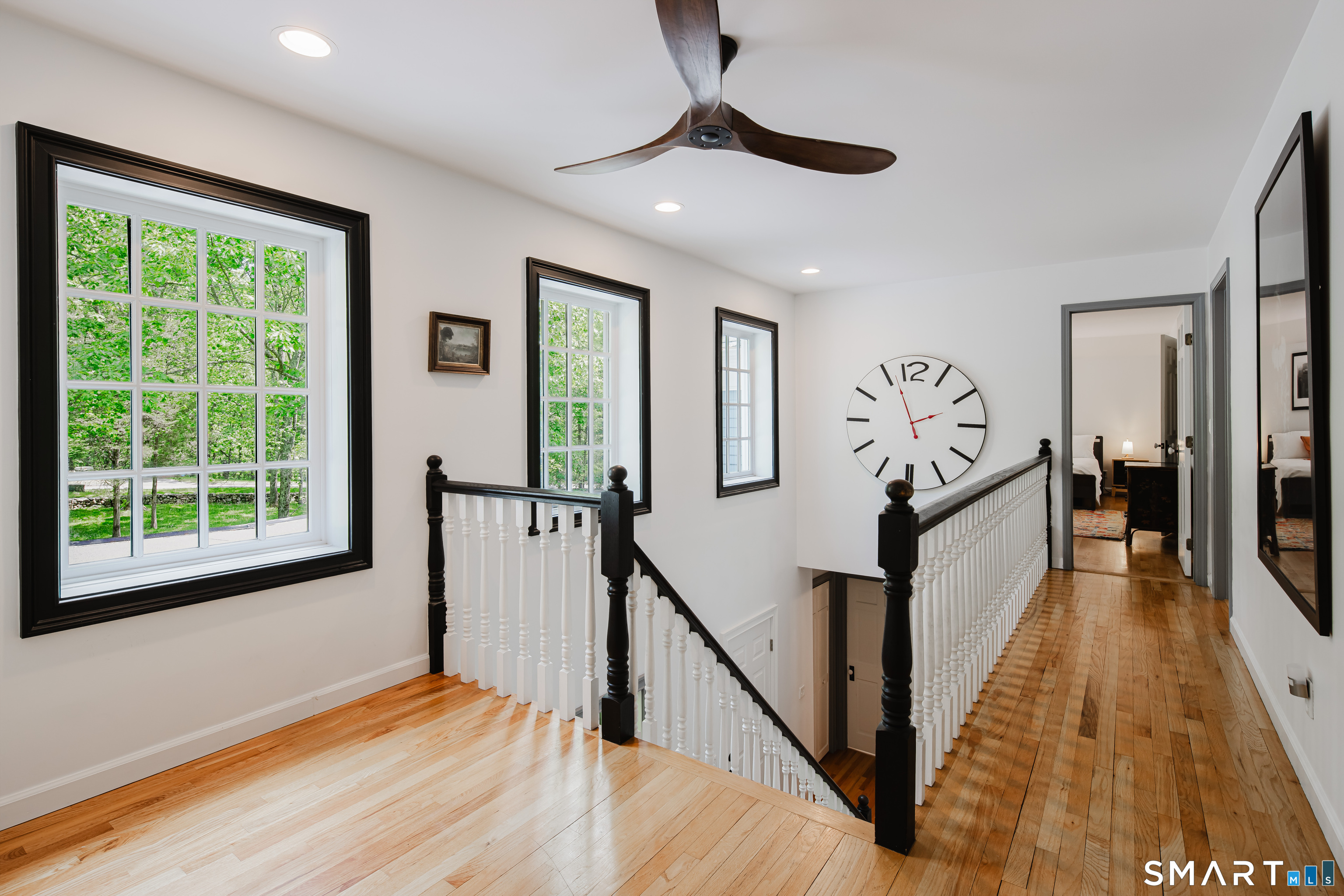 3 Partridge Trail Sherman, CT 06784 - Photo 24 of 37 a view of a hallway with wooden floor and stairs