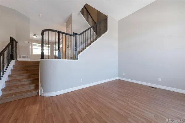 a view of an entryway with wooden floor