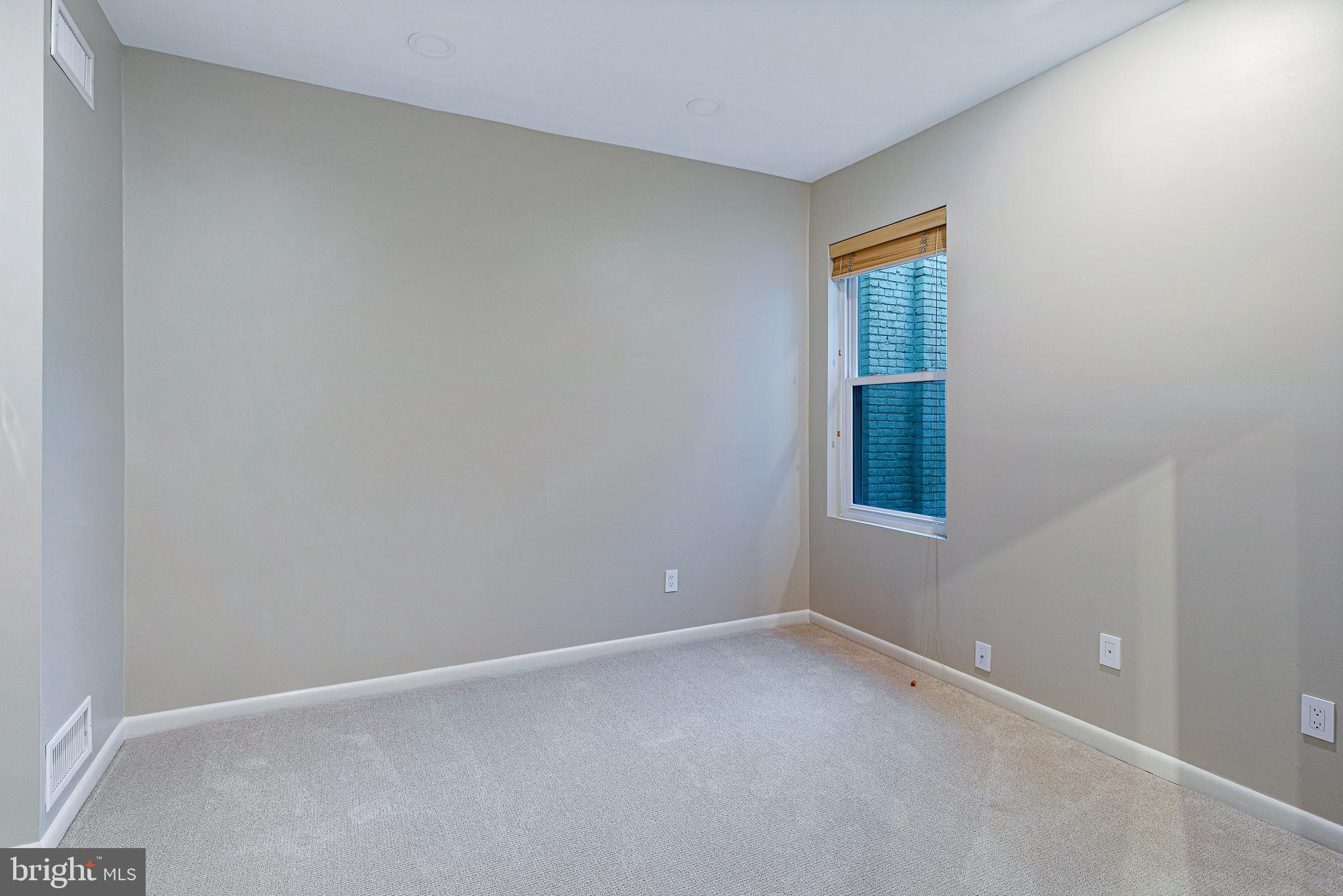 144 Tennessee Avenue Northeast Washington, DC 20002 - Photo 46 of 68 an empty room with a window