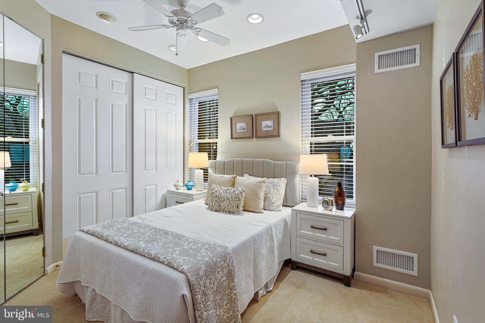 144 Tennessee Avenue Northeast Washington, DC 20002 - Photo 49 of 68 a bedroom with a large bed and a chandelier