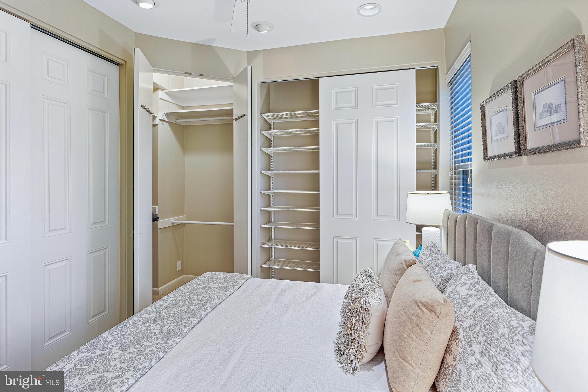 144 Tennessee Avenue Northeast Washington, DC 20002 - Photo 50 of 68 a bedroom with a bed and a walk in closet