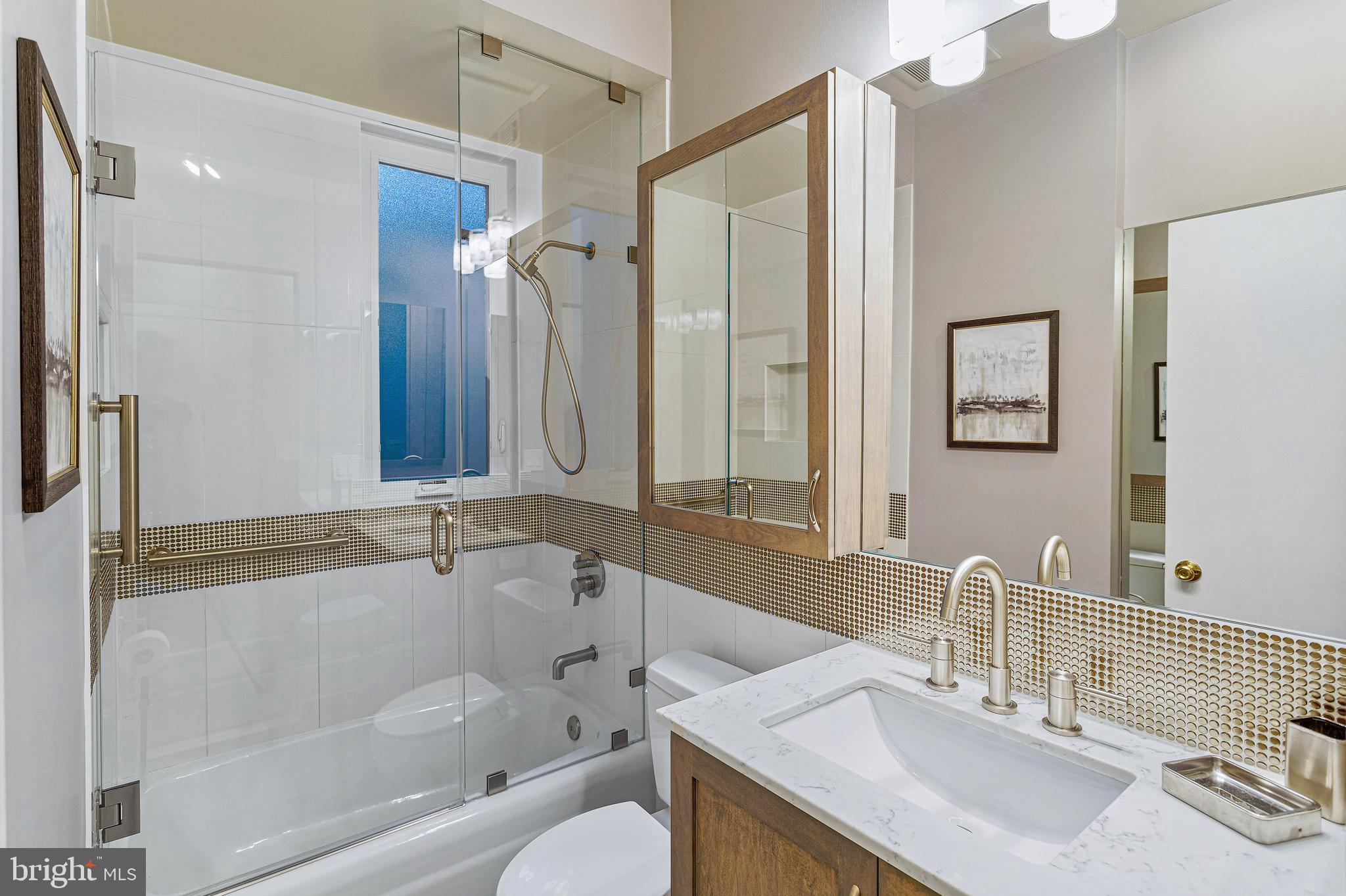 144 Tennessee Avenue Northeast Washington, DC 20002 - Photo 53 of 68 a bathroom with a granite countertop sink mirror and a bathtub