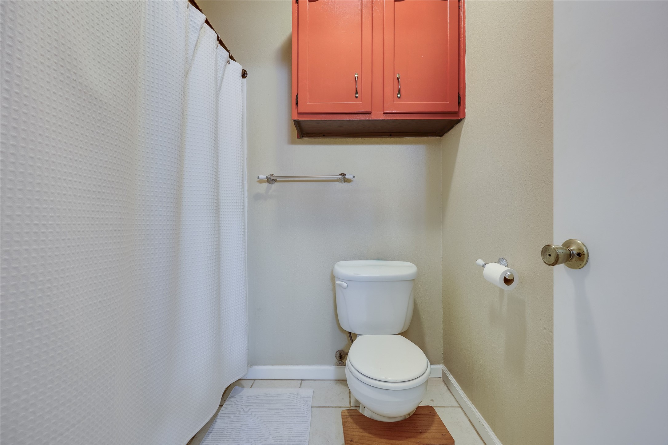 3011 Fruth Street, Unit 101 Austin, TX 78705 - Photo 11 of 14 Functional full bathroom with practical built-in cabinetry and durable tile flooring.