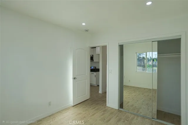 an empty room with an entrance to other room