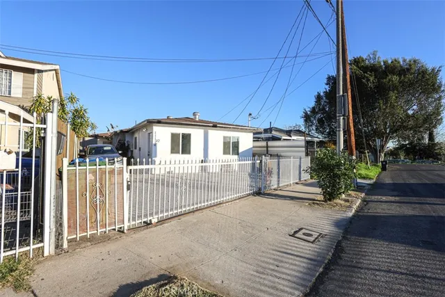 a view of a house with a wooden deck