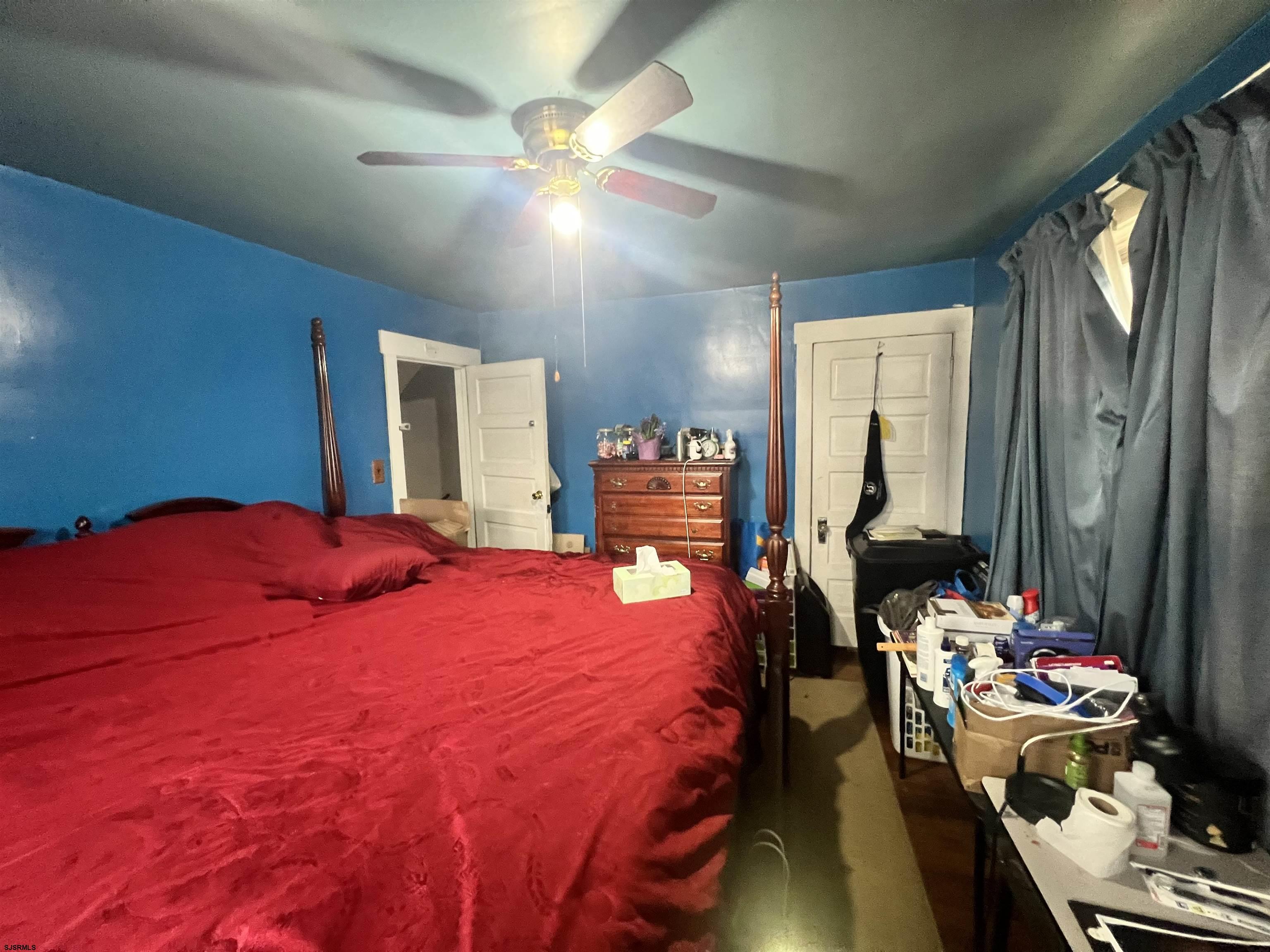 2 9th Street Salem, NJ 08079 - Photo 20 of 33 a bedroom with a bed and a chandelier