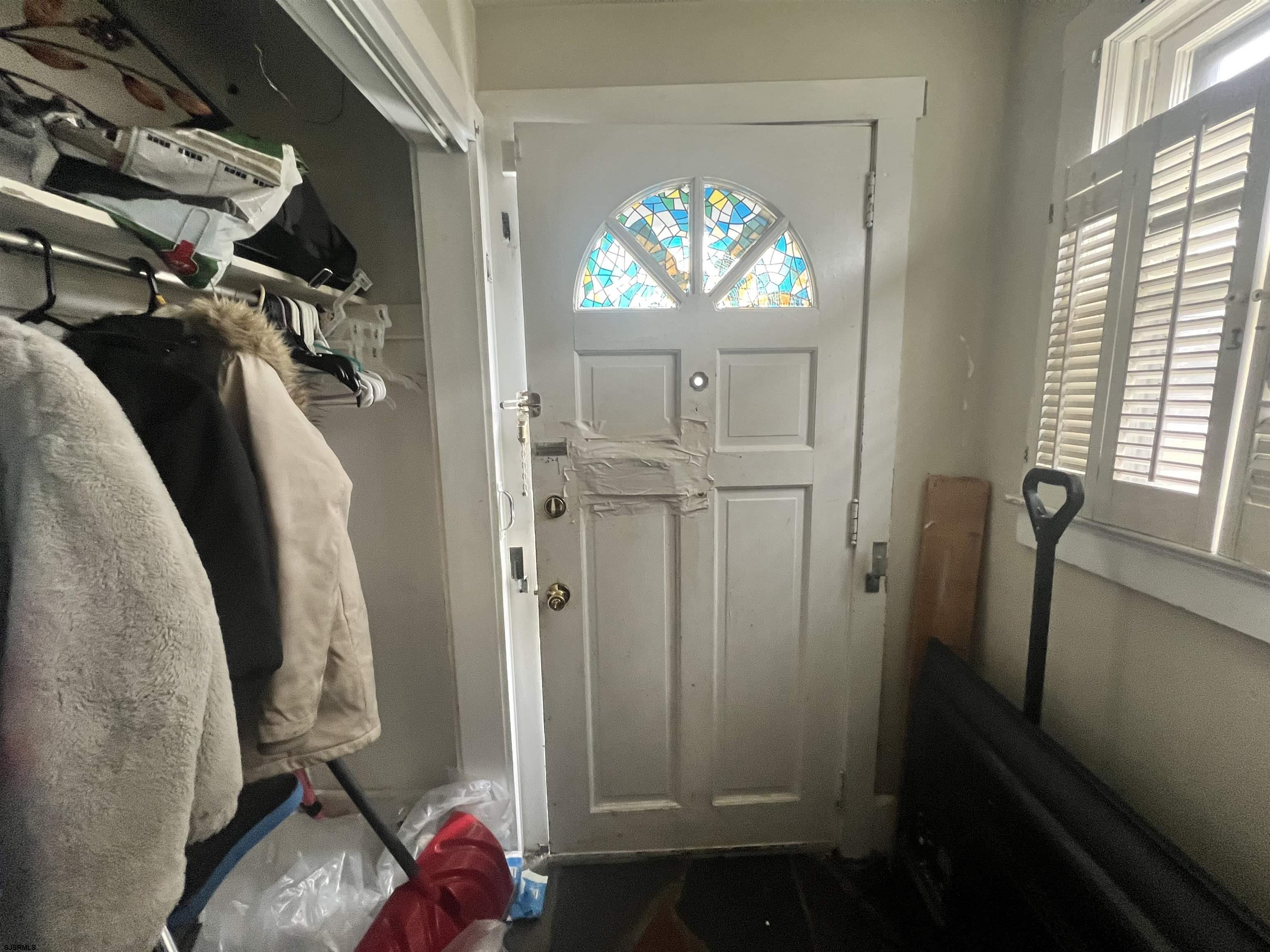 2 9th Street Salem, NJ 08079 - Photo 8 of 33 a view of walk in closet with window and chandelier