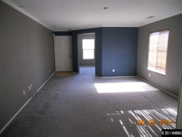 7732 Corso Street Reno, NV 89506 - Photo 3 of 13 an empty room with windows