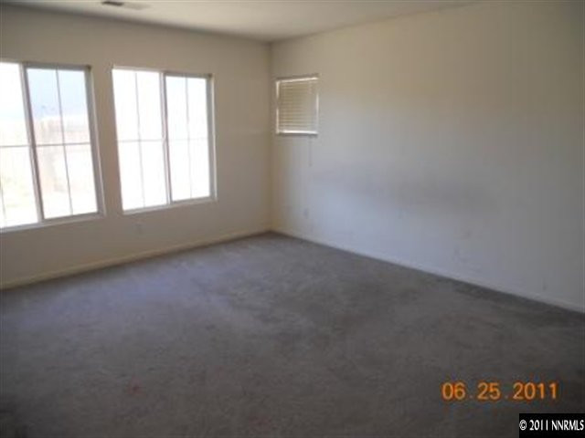 7732 Corso Street Reno, NV 89506 - Photo 7 of 13 an empty room with a window