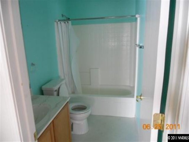 7732 Corso Street Reno, NV 89506 - Photo 10 of 13 a bathroom with a shower and a toilet