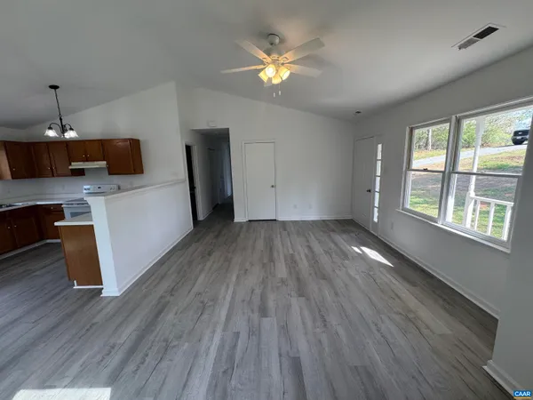 a view of kitchen and wooden floor