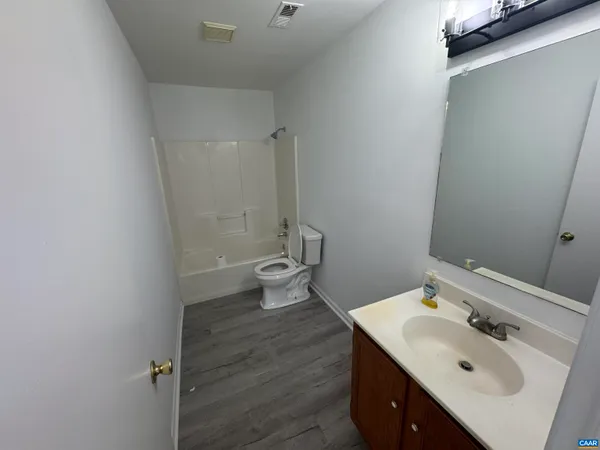 a bath room with a sink and a toilet