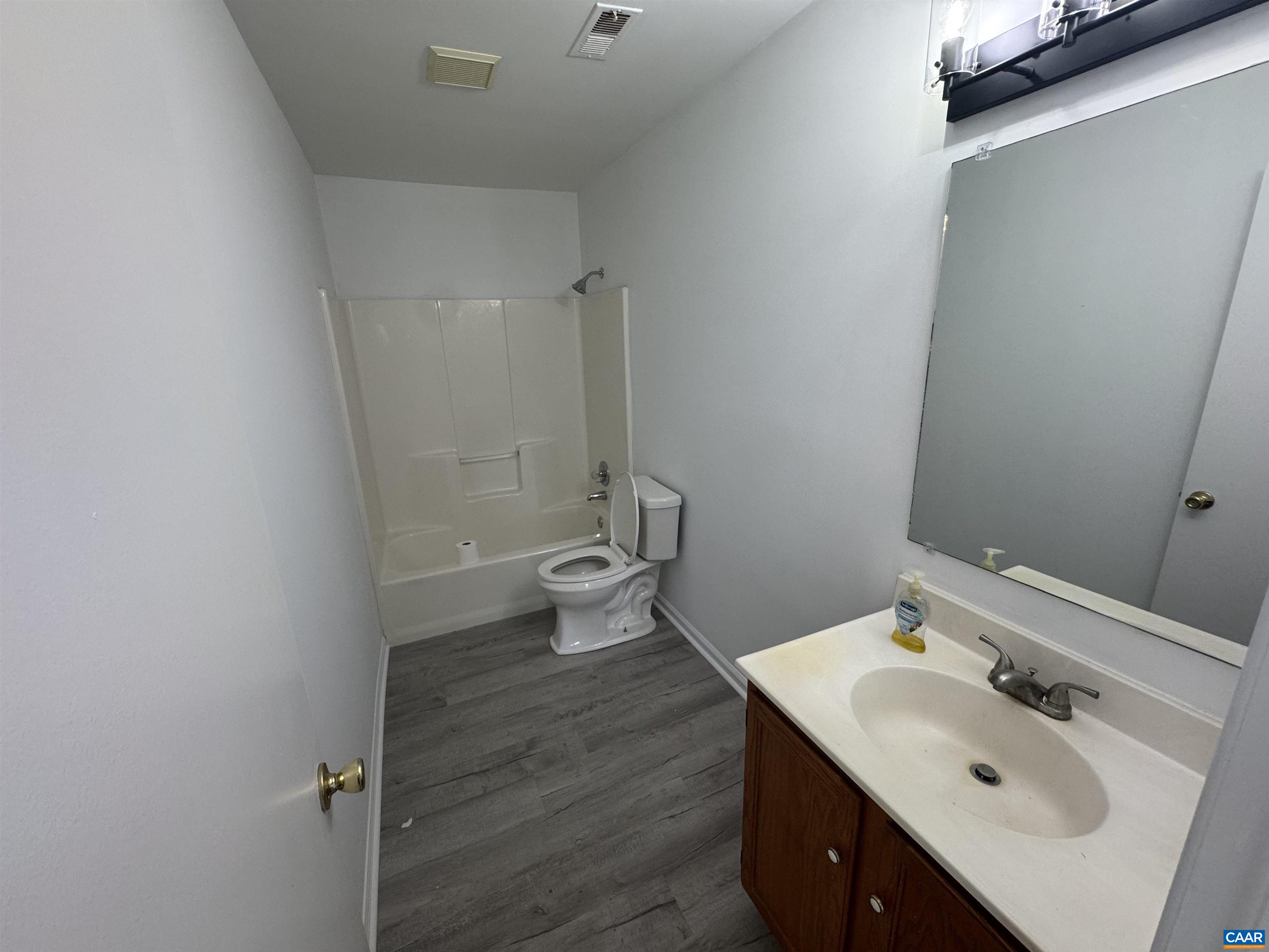109 Narcissus Road Ruckersville, VA 22968 - Photo 12 of 27 a bath room with a sink and a toilet
