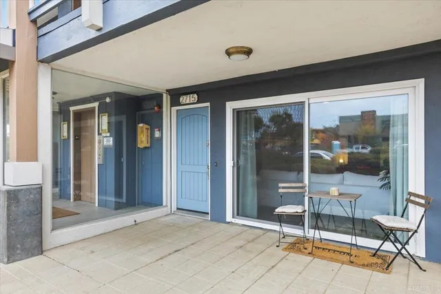 a view of a room with glass door and glass door