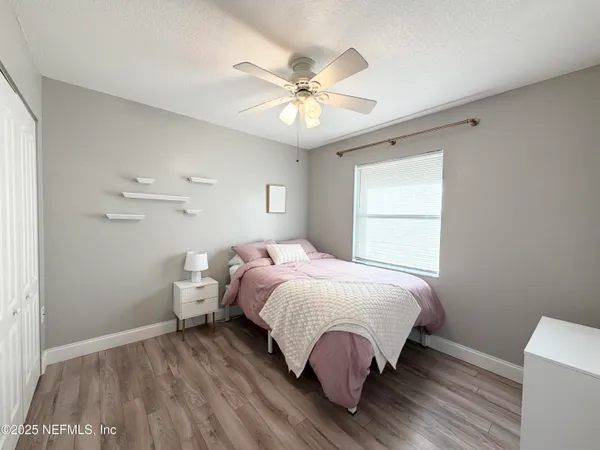 a bed room with a bed and a window