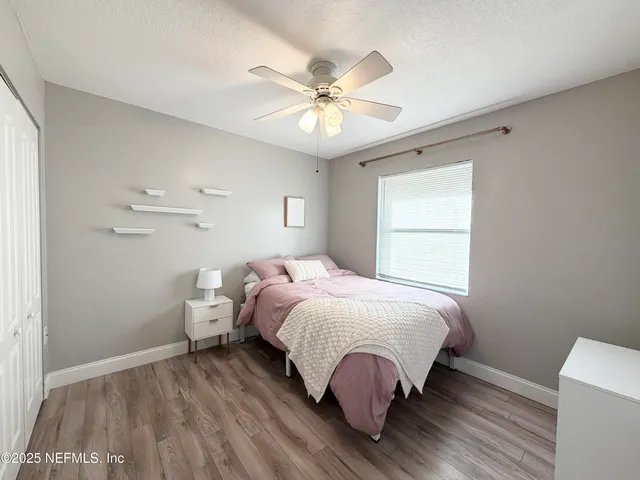 a bed room with a bed and a window