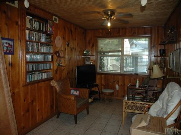 307 Rue Max Street Pensacola, FL 32507 - Photo 3 of 38 The den has wood paneling and built in bookcase