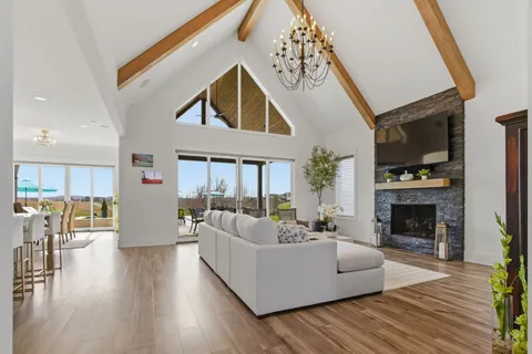 a kitchen with stainless steel appliances granite countertop a stove top oven a sink a counter space and cabinets