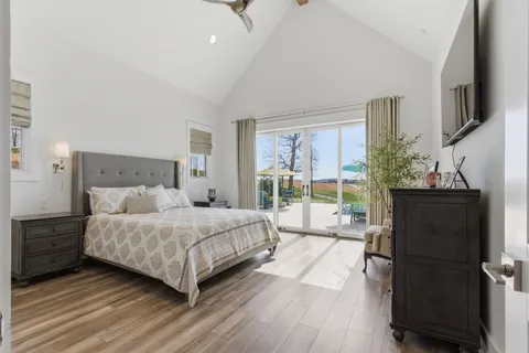 a bed room with a bed and a chandelier