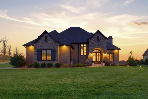 a front view of a house with a yard