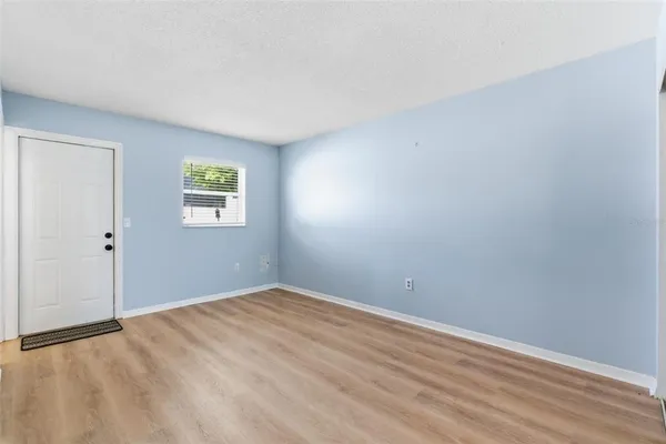 a view of empty room with windows