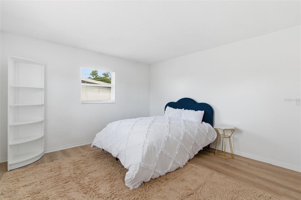 2227 Montclair Drive Sarasota, FL 34231 - Photo 44 of 48 a bedroom with a bed and a window