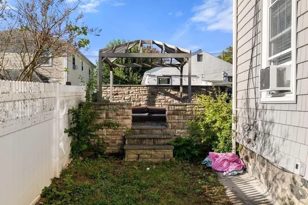a front view of a house with an outdoor space