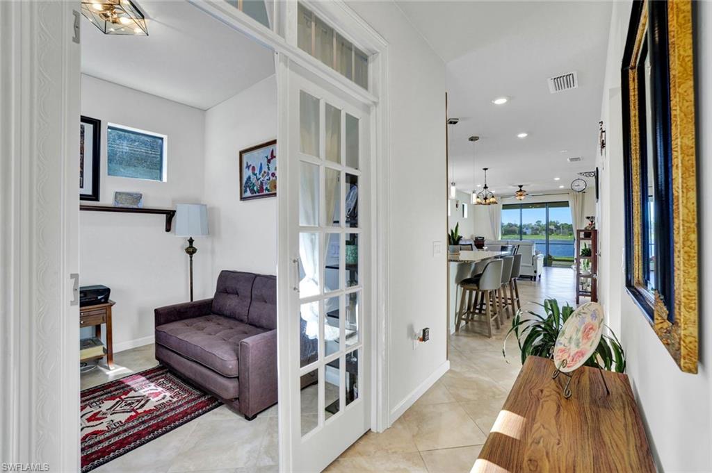 2171 Yellowfin Circle Naples, FL 34114 - Photo 20 of 38 a living room with furniture and a rug