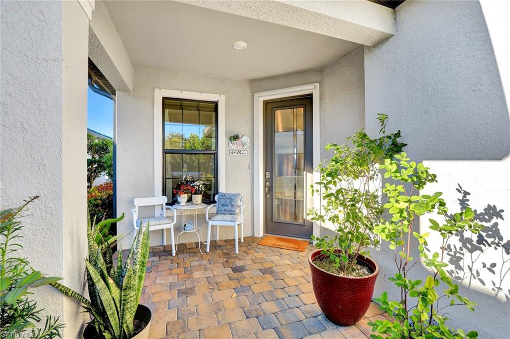 2171 Yellowfin Circle Naples, FL 34114 - Photo 23 of 38 a view of a chairs and table in a patio