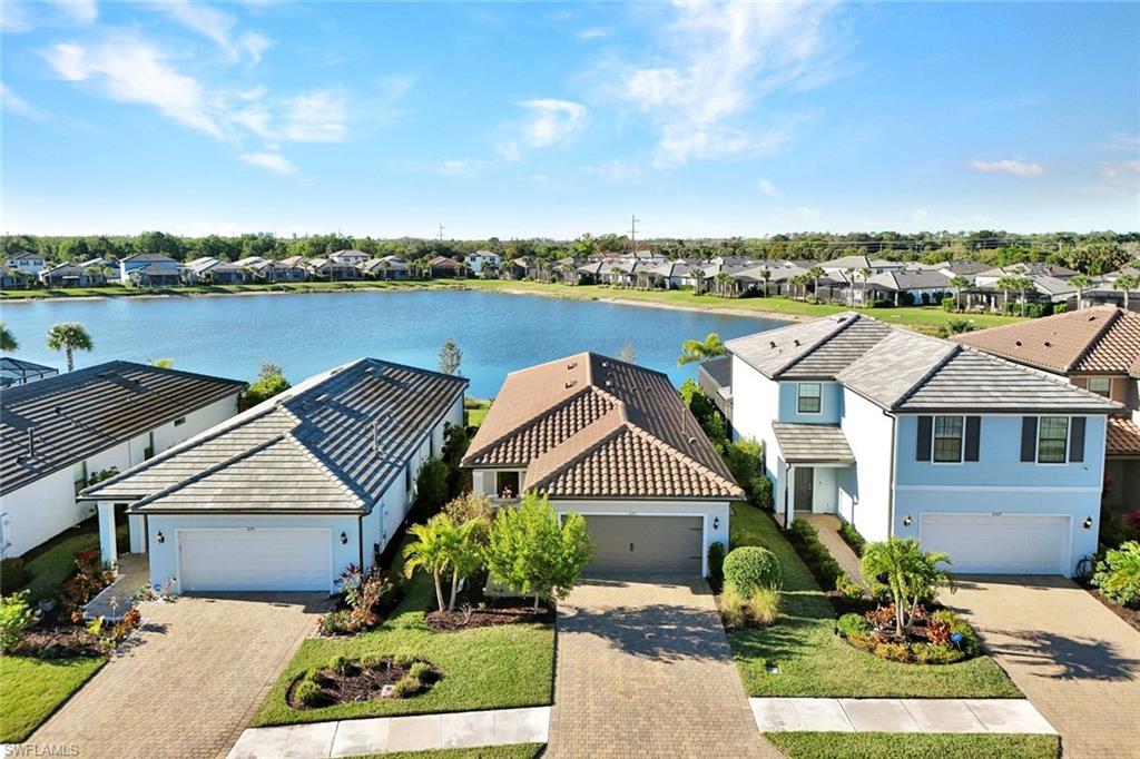 2171 Yellowfin Circle Naples, FL 34114 - Photo 25 of 38 a front view of a house with garden