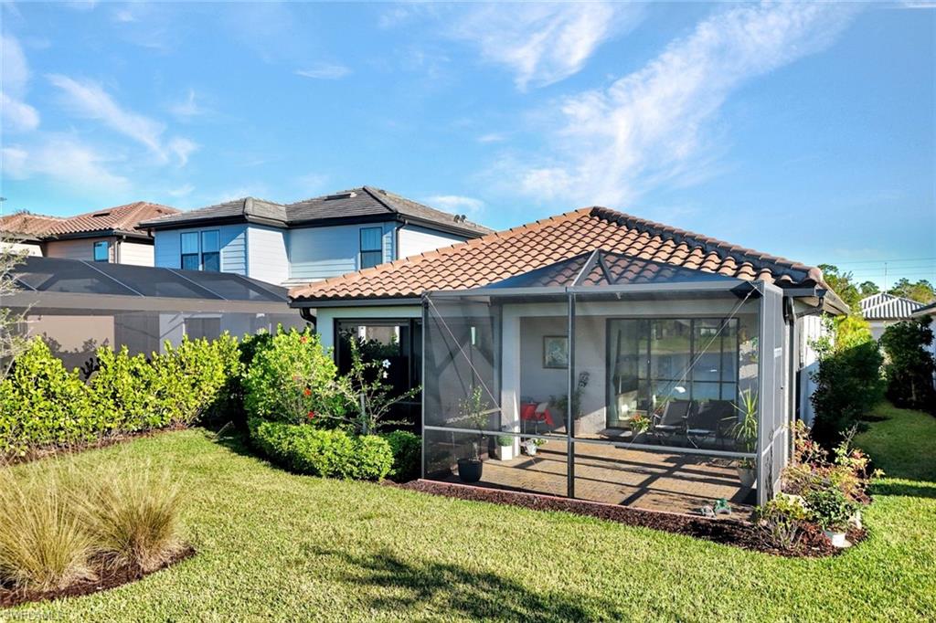 2171 Yellowfin Circle Naples, FL 34114 - Photo 26 of 38 front view of a house with a yard