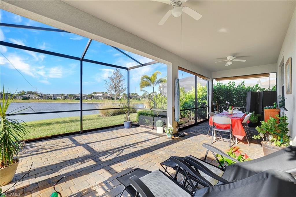 2171 Yellowfin Circle Naples, FL 34114 - Photo 4 of 38 a room with furniture and a large window
