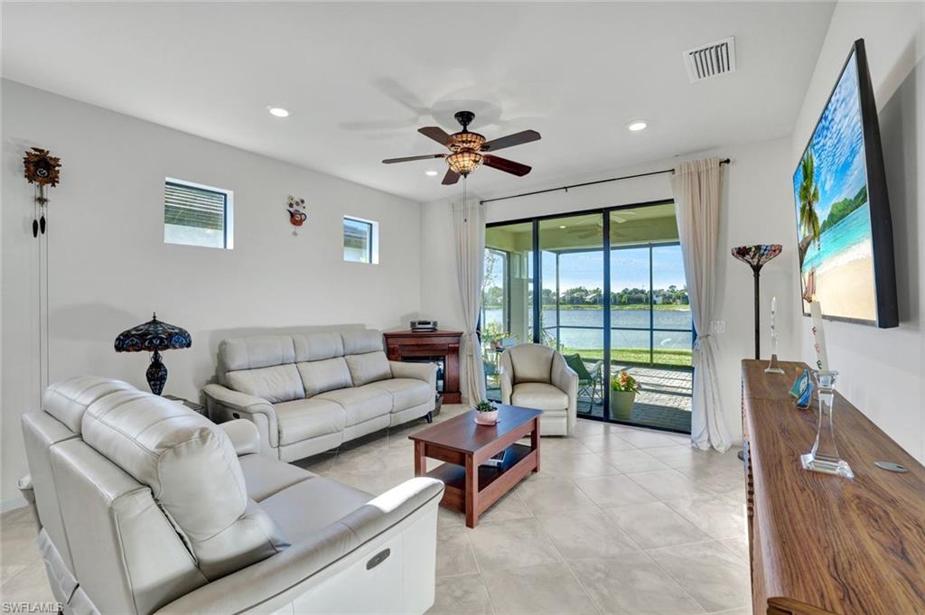 2171 Yellowfin Circle Naples, FL 34114 - Photo 9 of 38 a living room with furniture and a large window