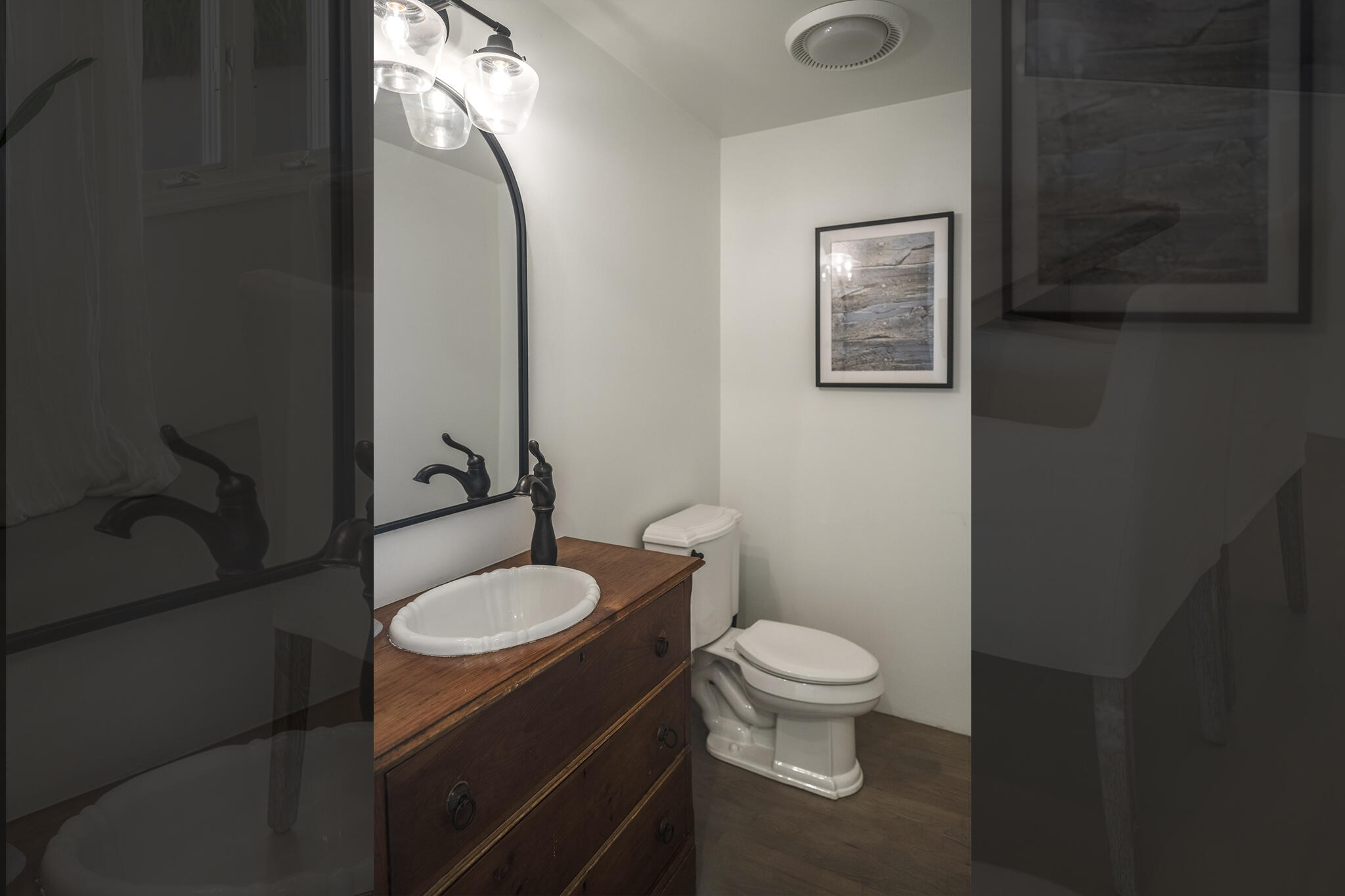 1647 Posilipo Lane, Unit B Montecito, CA 93108 - Photo 18 of 37 a bathroom with a granite countertop toilet sink and mirror