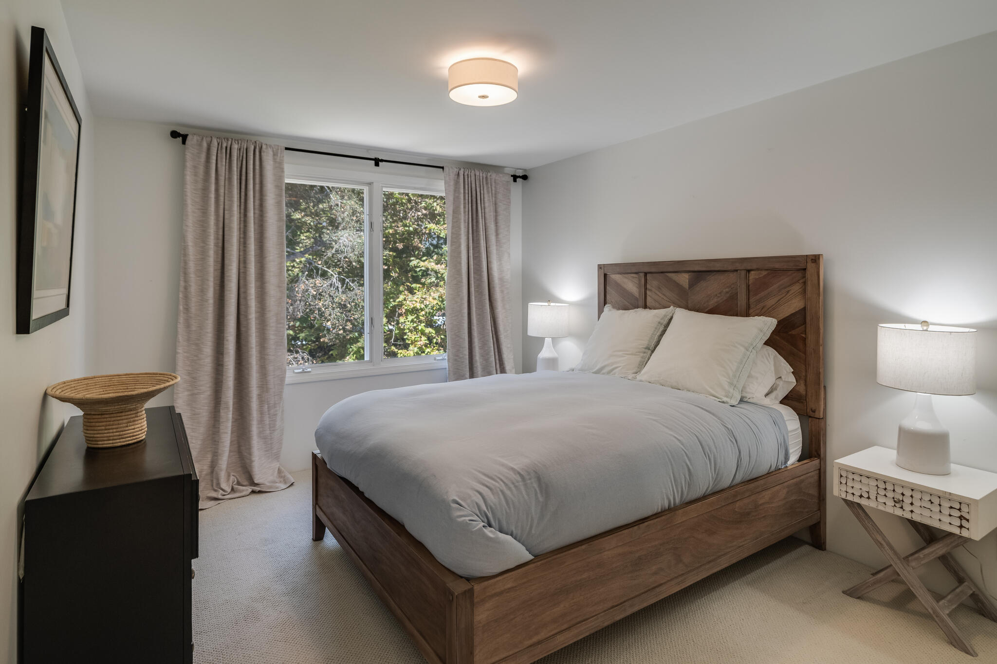 1647 Posilipo Lane, Unit B Montecito, CA 93108 - Photo 23 of 37 a large bed sitting in a bedroom next to a window